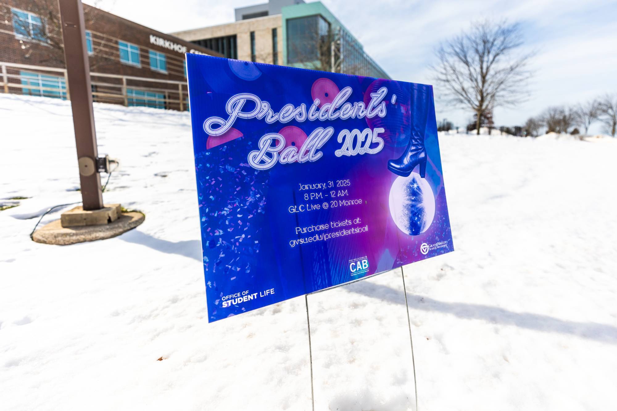 Yard sign that says Presidents' Ball 2025 January, 31 2025 8 P.M. - 12 A.M. GLC Live @ 20 Monroe Purchase tickets at: gvsu.edu/presidentsball